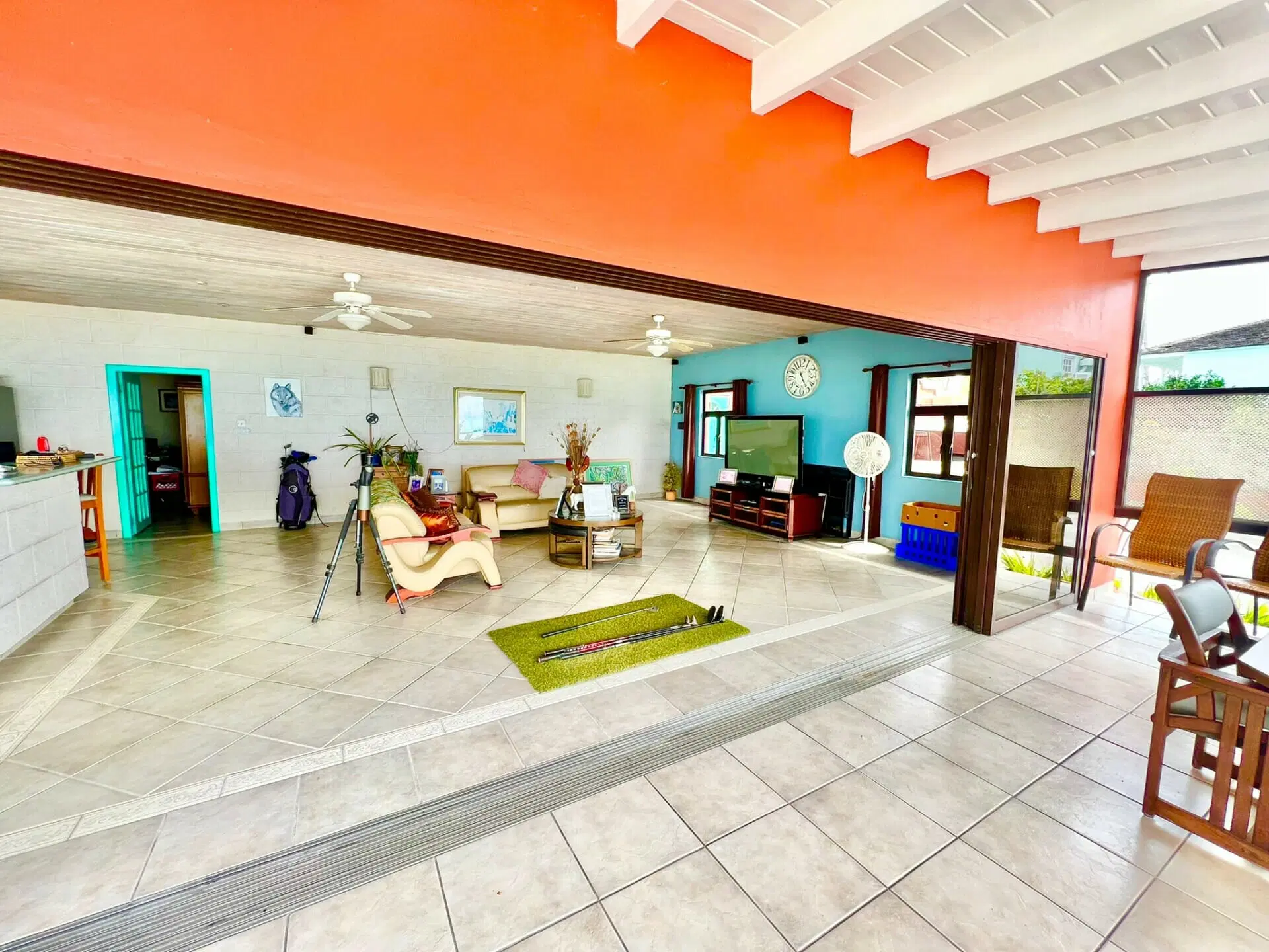 Open great room with television and seating